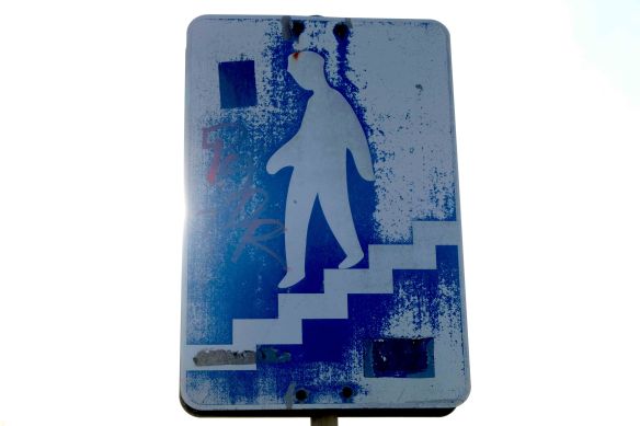 Sign walking down stairs