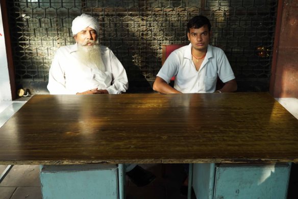 two sikhs sitting down