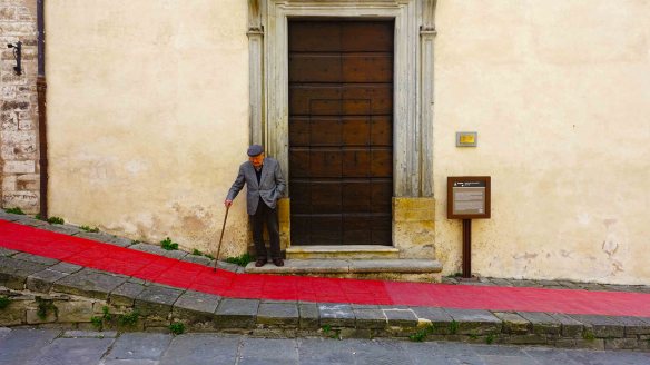 Man by door with carpet