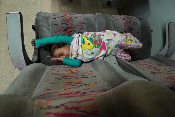 child sleeping on train