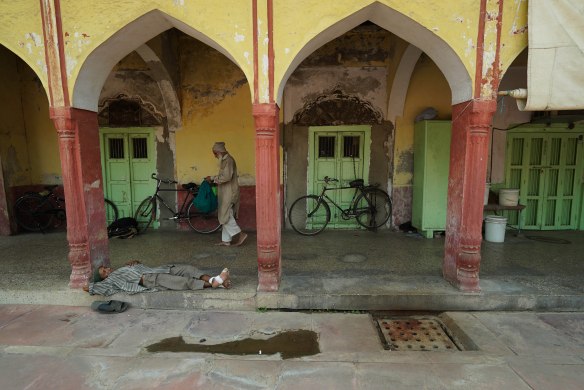 man resting in mosque